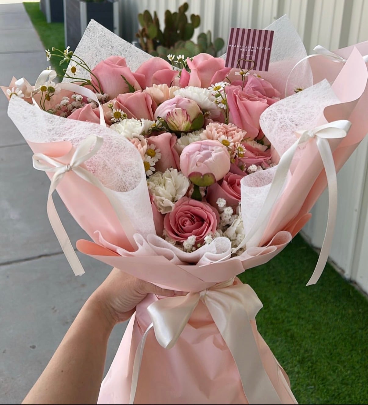 Blush pink wrapped bouquet with roses and peonies