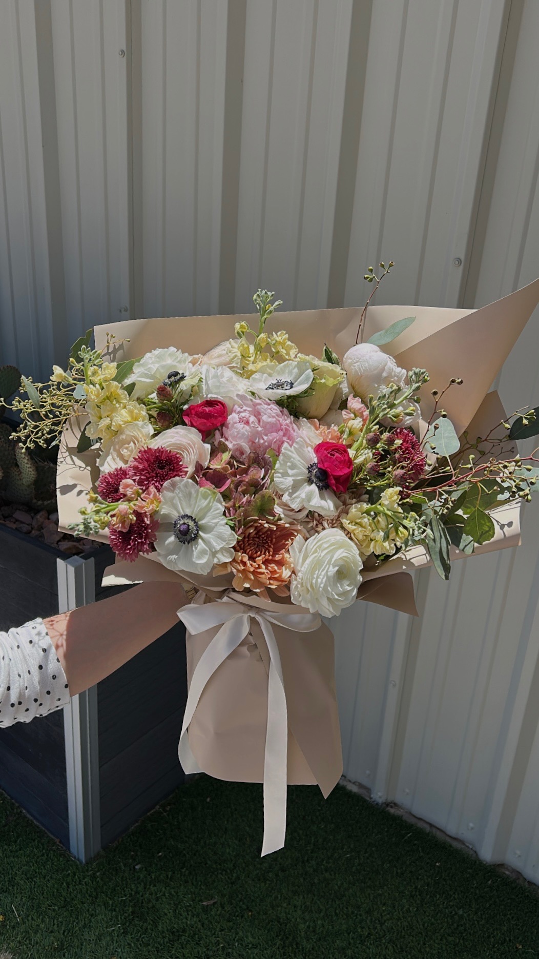 Pastel garden bouquet with anemones and ranunculus